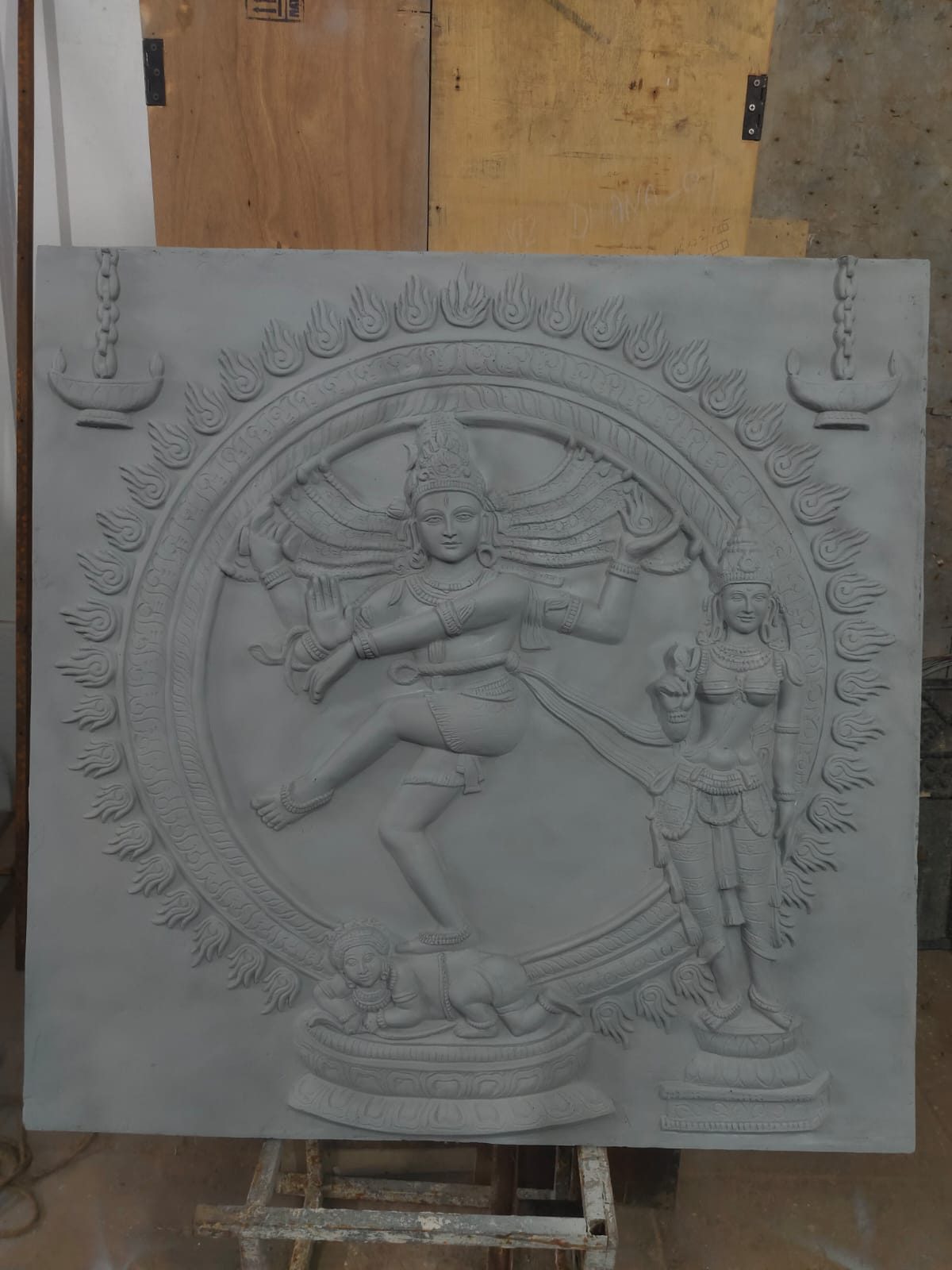 Grey cement relief of Nataraja, the cosmic dancer