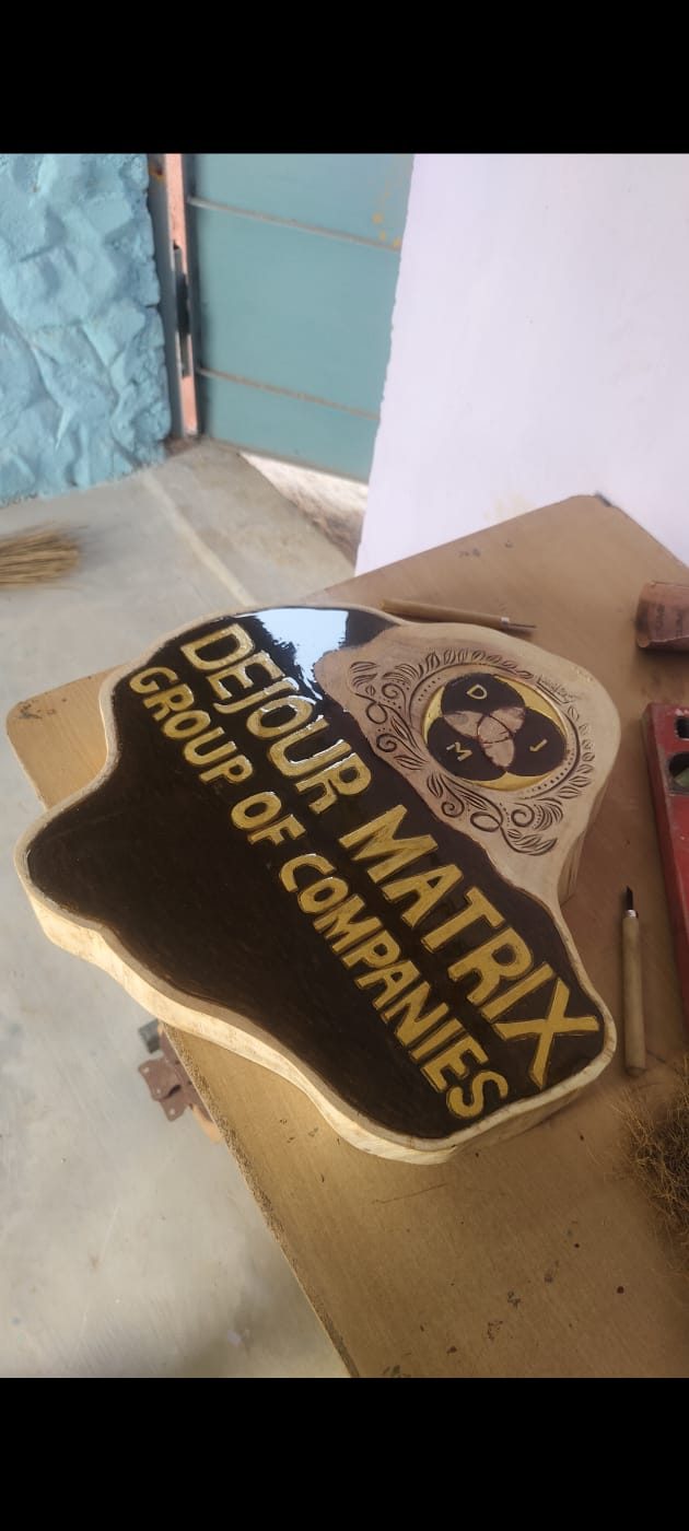 Custom wood signage board with gold lettering and epoxy coating for a corporate client
